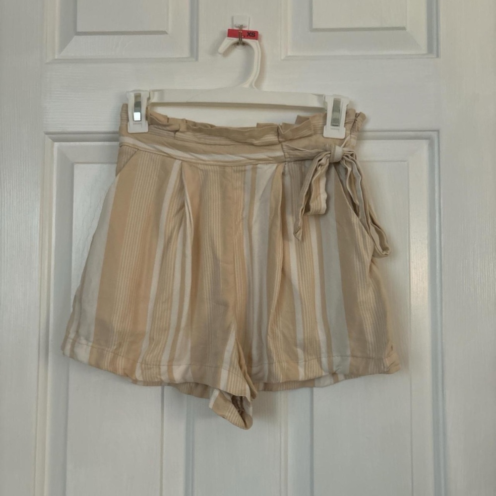 Striped white and tan flowy shorts, tie and zipper on side